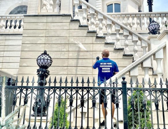 Top Team pressure washing building facade